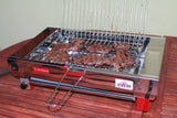 Bistecca in cottura su bistecchiera elettrica CF Inox G27x23 — senza fumo grazie al sistema ad acqua