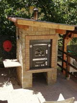 Forno a legna Clementi da incasso integrato in muratura esterna con barbecue — cucina outdoor