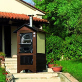Forno a legna Clementi Master finitura ramata da esterno — ambientato in giardino privato