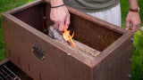 BBQ Clementi Flipper corten con fuoco acceso — schema camera combustione posteriore, brace pronta